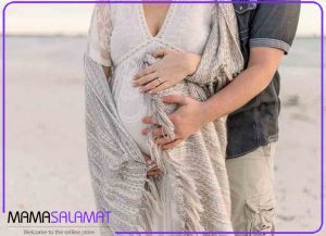 ضد آفتاب مناسب بارداری-تصویر مادر بادر و پدر در روز های سرد