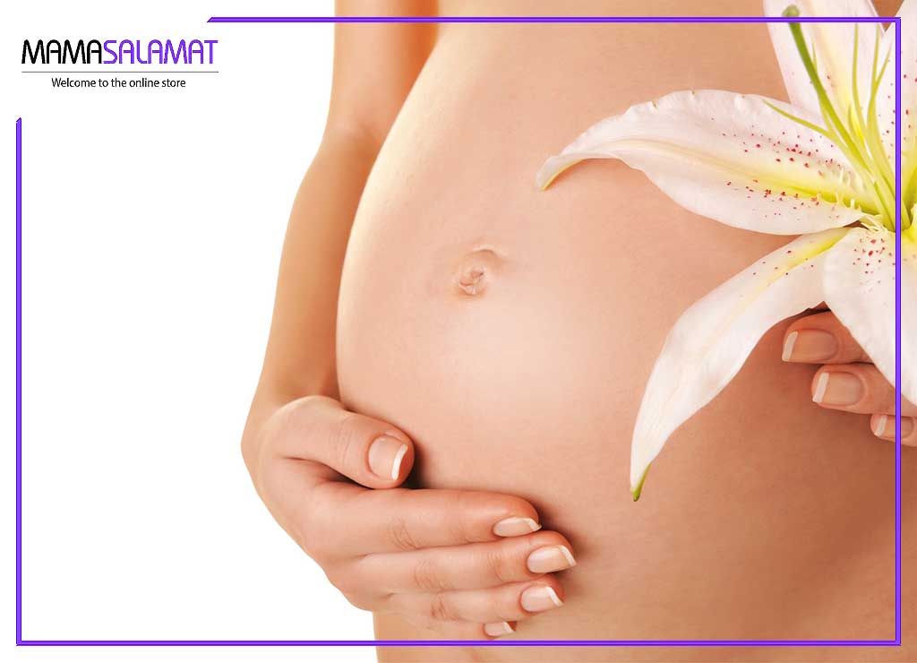 شستشوی ناحیه تناسلی در بارداری شکم زن باردار و گل لیلیوم
